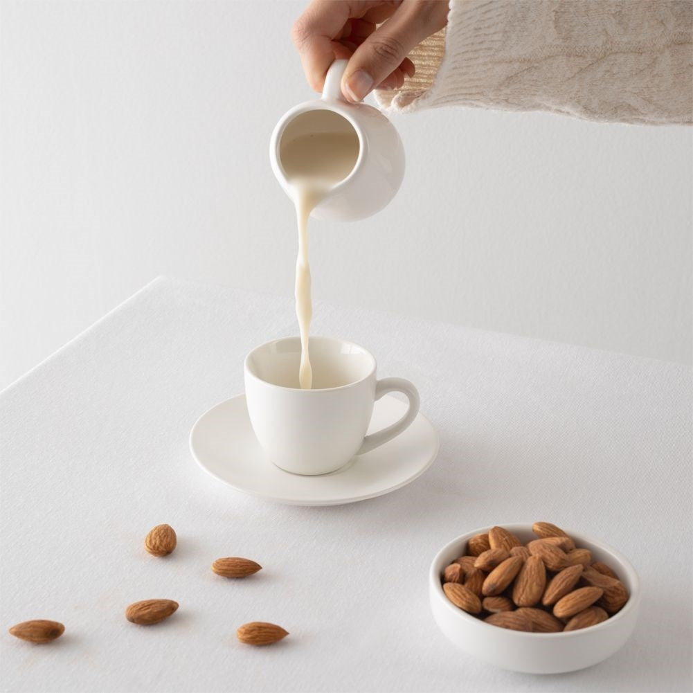Porcelain milk jug with handle and practical spout