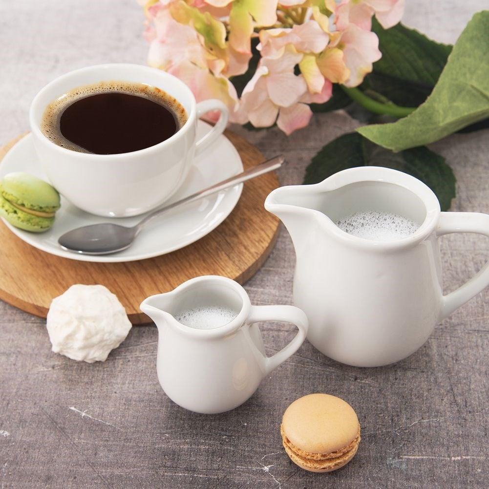 Porcelain milk jug with handle and practical spout