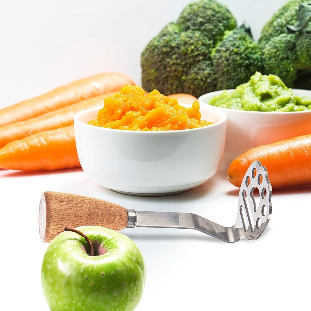 Potato masher in stainless steel and wood for puree and fruit