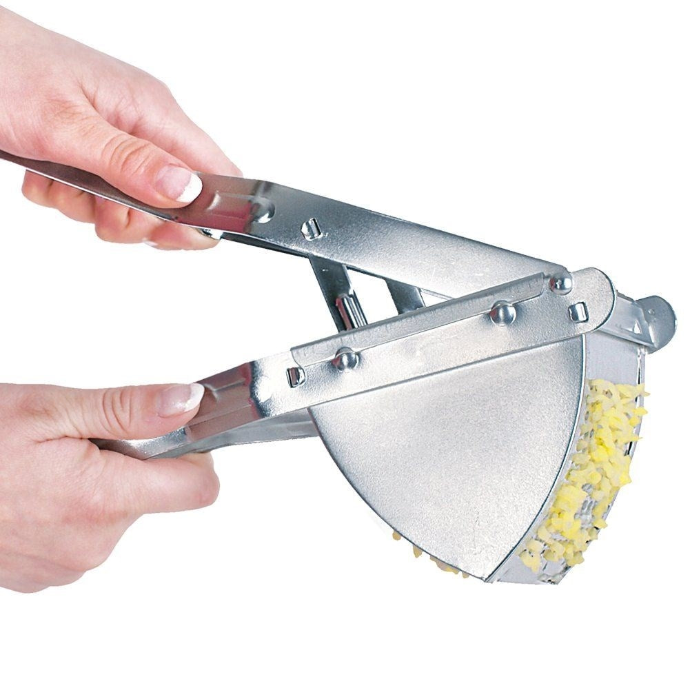 Potato press in galvanized metal for potatoes and fruit