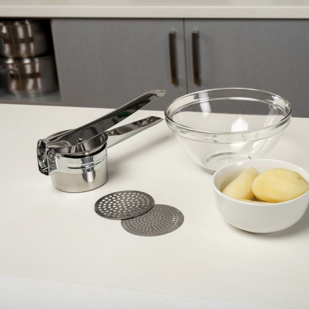 Potato press in stainless steel with two replaceable inserts