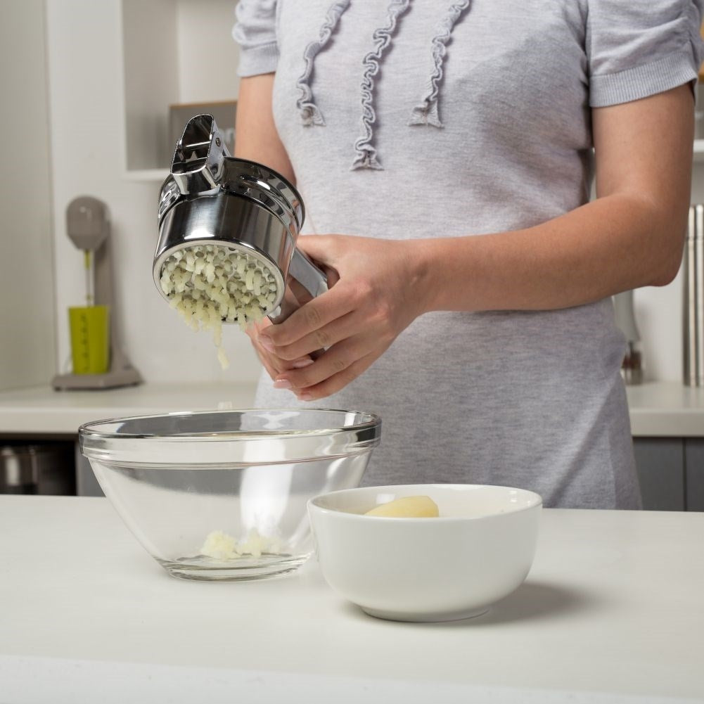 Potato press in stainless steel with two replaceable inserts