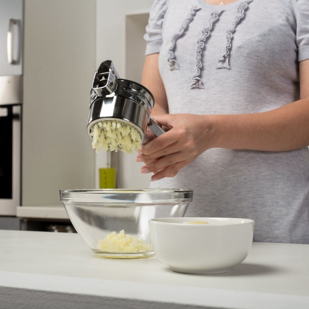Potato press in stainless steel with two replaceable inserts