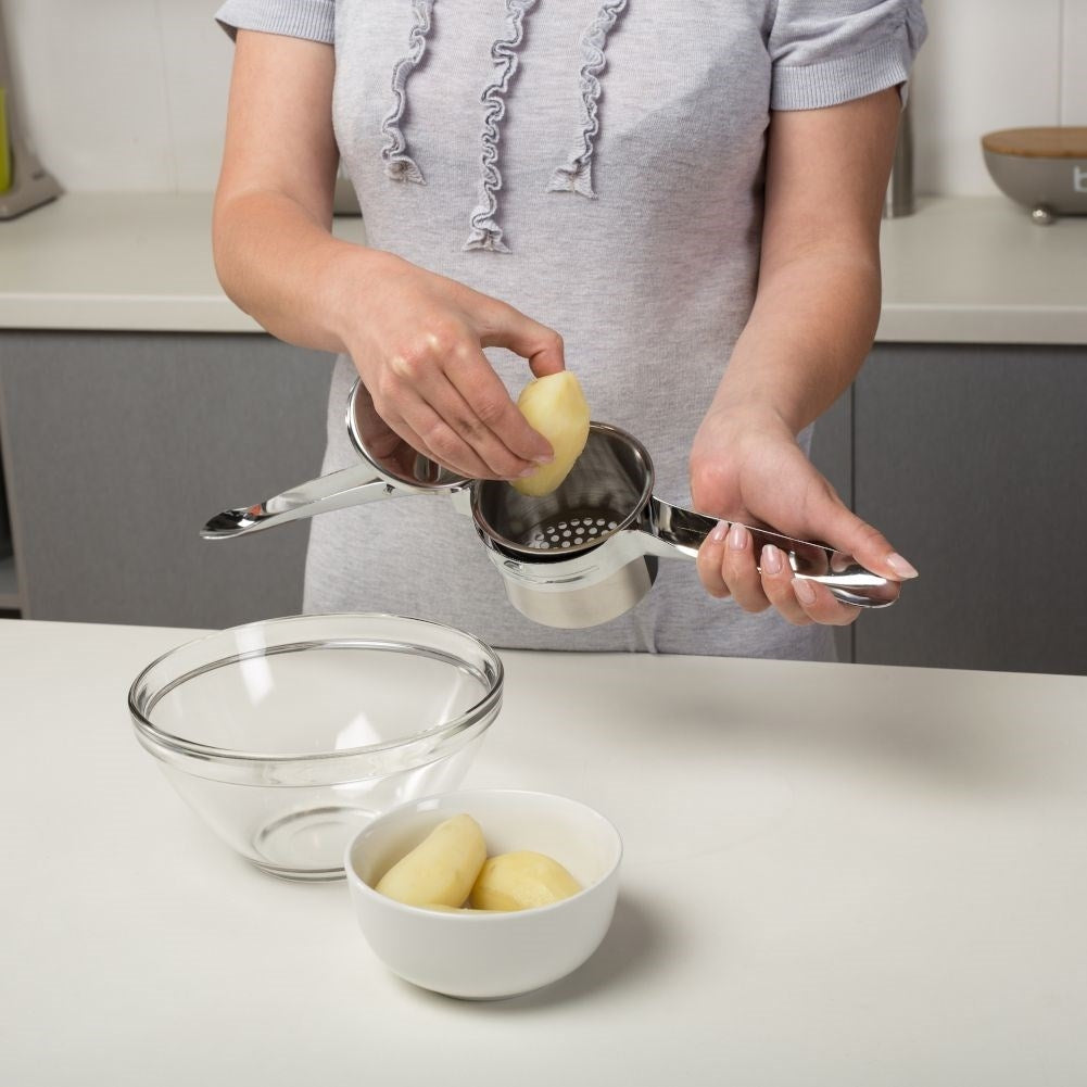 Potato press in stainless steel with two replaceable inserts