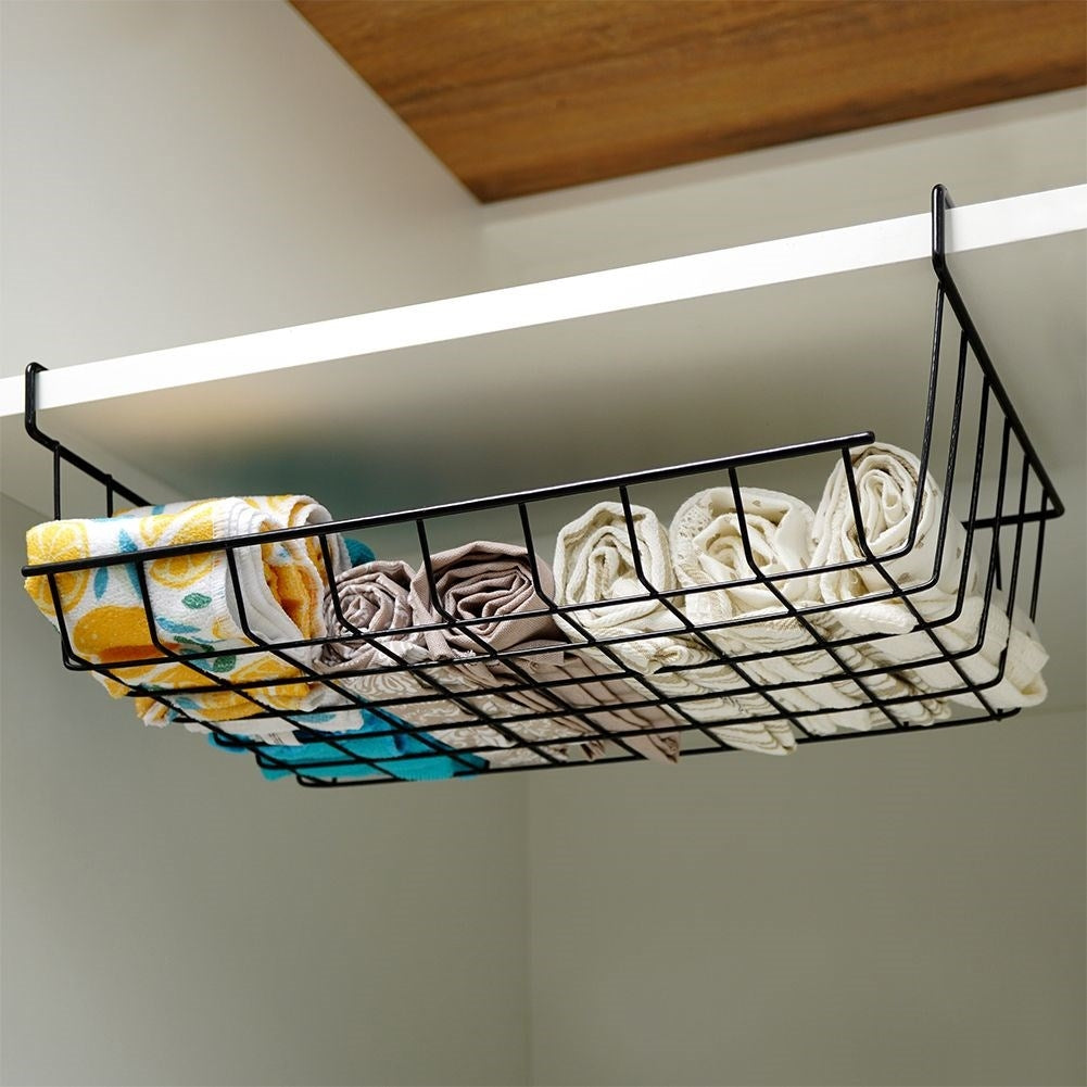 Practical black metal basket for extra space under the shelf