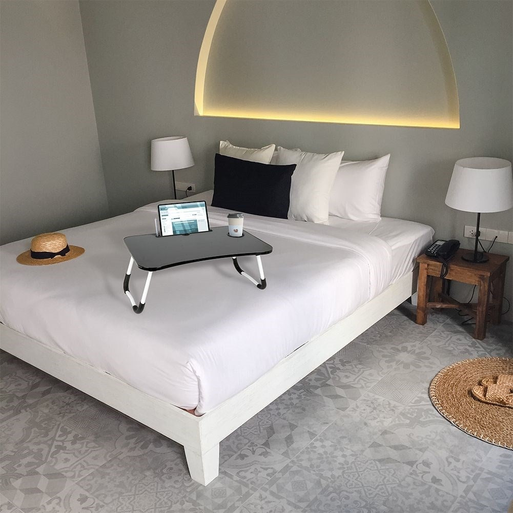 Practical breakfast table for the bed with space for a tablet