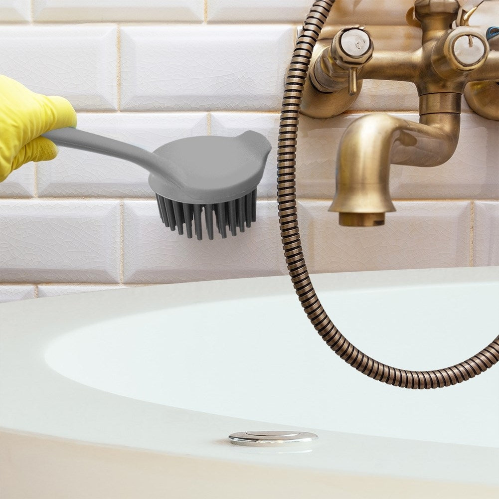 Practical gray plastic kitchen brush with silicone bristles.