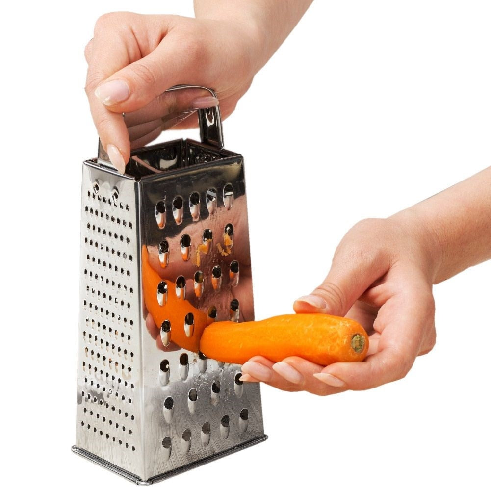 Practical kitchen grater with four blades for different tasks