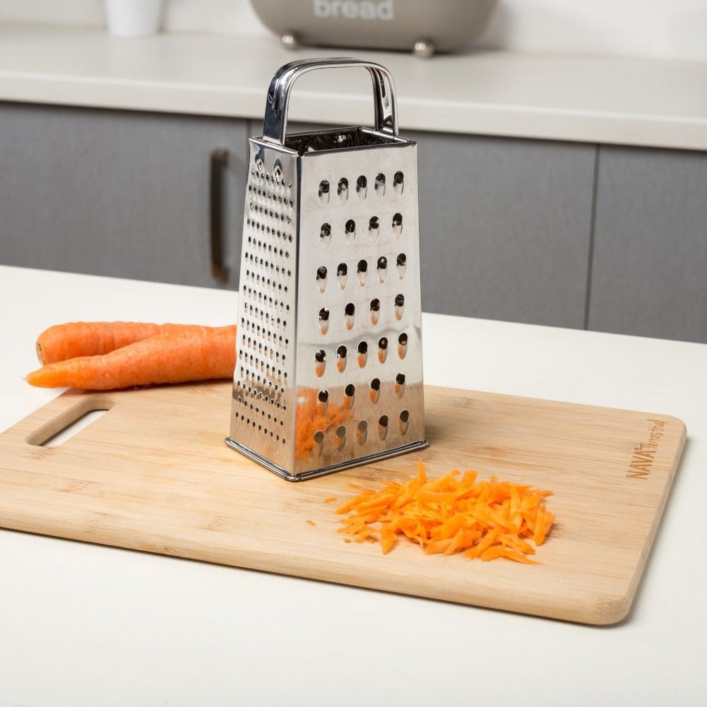 Practical kitchen grater with four blades for different tasks