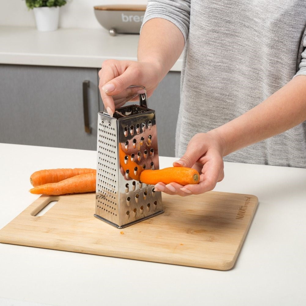 Practical kitchen grater with four blades for different tasks