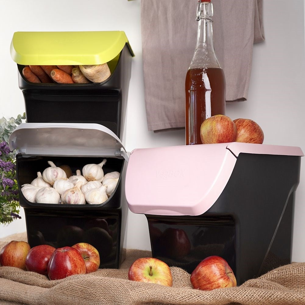 Practical plastic box for fruit and vegetables with an openable flap