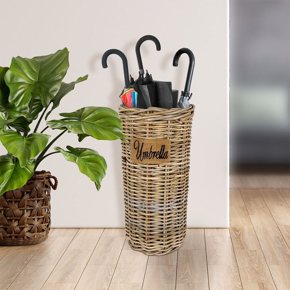 Practical umbrella stand in natural rattan, protects the floor.