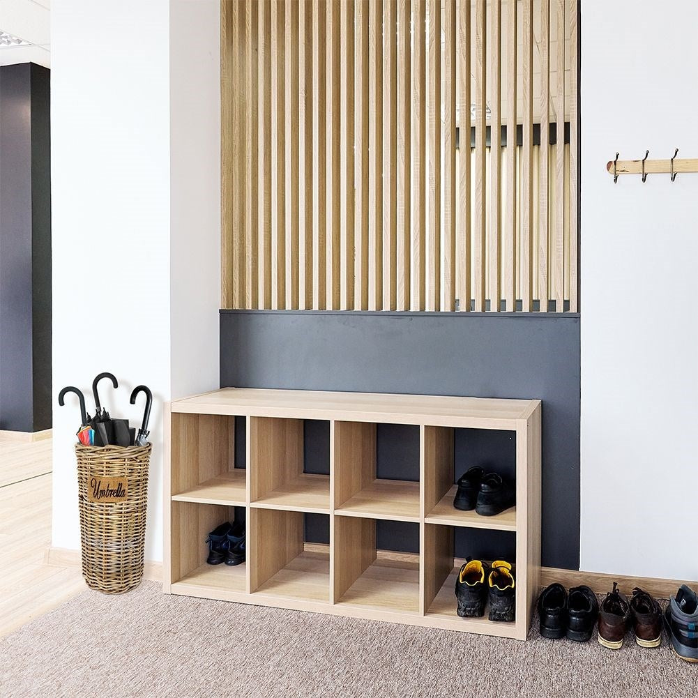 Practical umbrella stand in natural rattan, protects the floor.