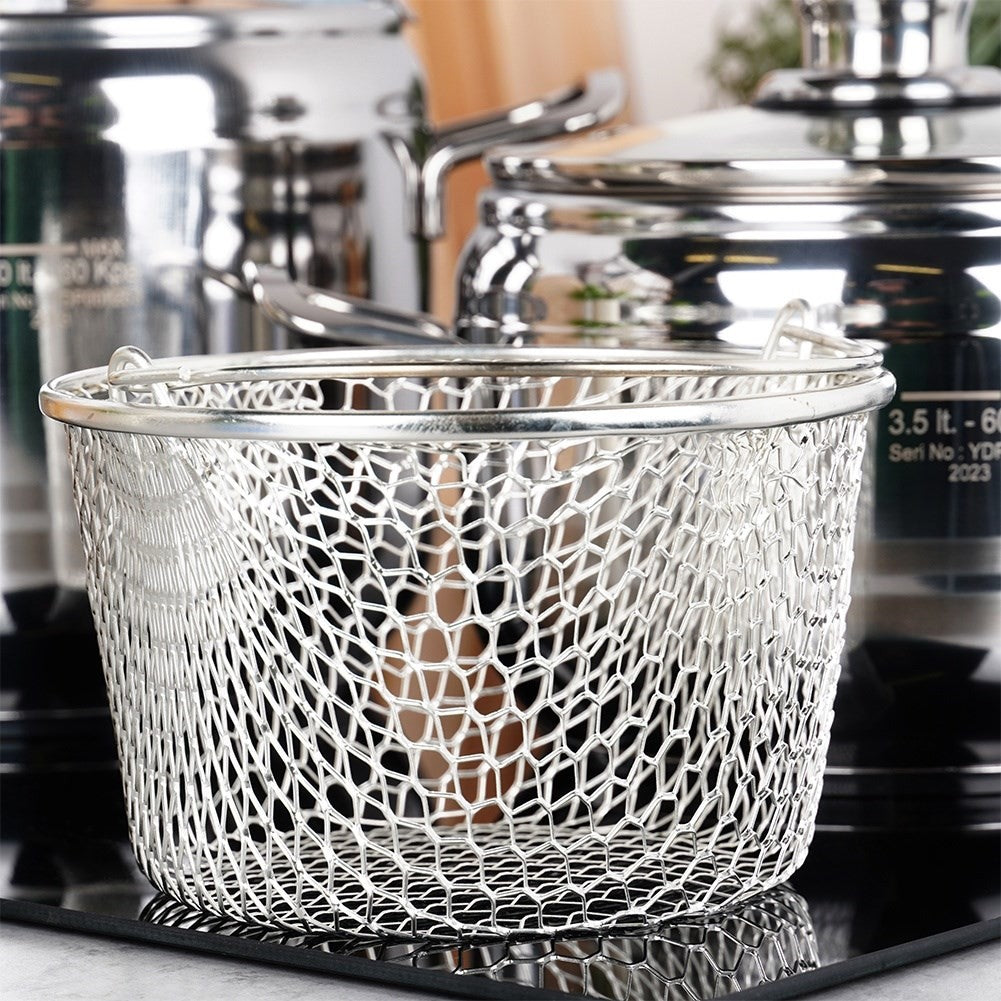 Pressure cooker with multi-layer base and safety valves