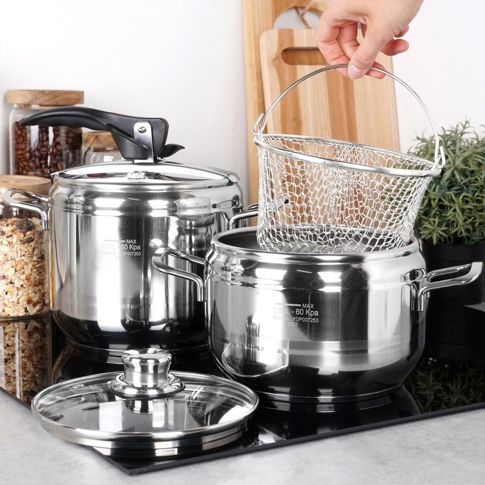 Pressure cooker with multi-layer base and safety valves