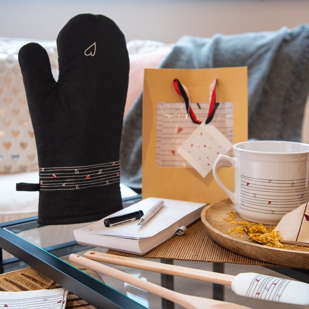 Protective cotton glove with hanging loop and magnet