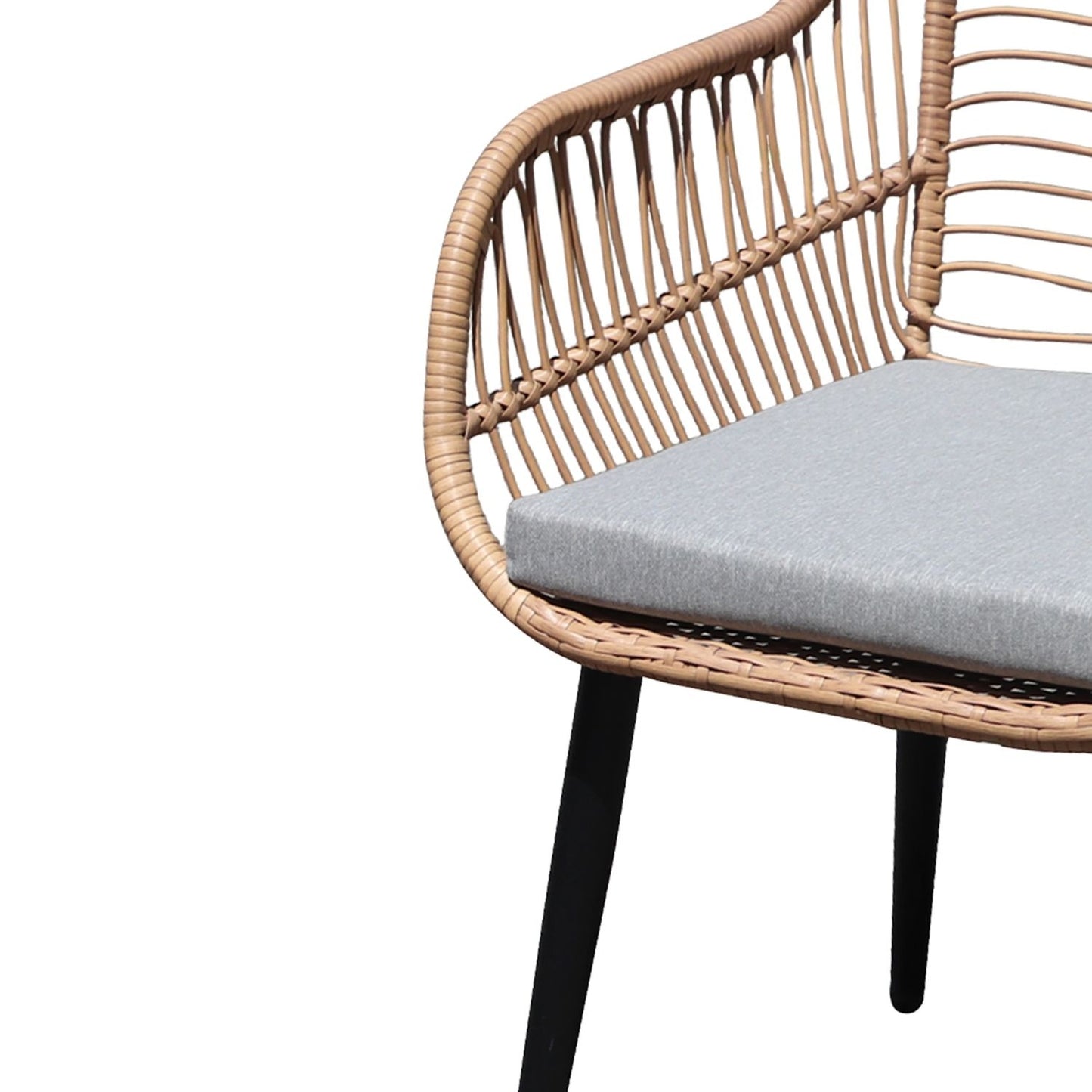 Rattan garden furniture set with chairs and a table with a glass top