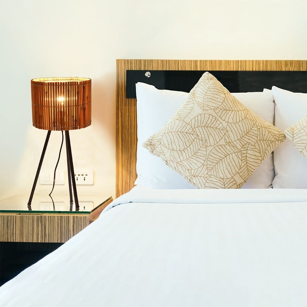 Rattan table lamp with black metal legs for any room