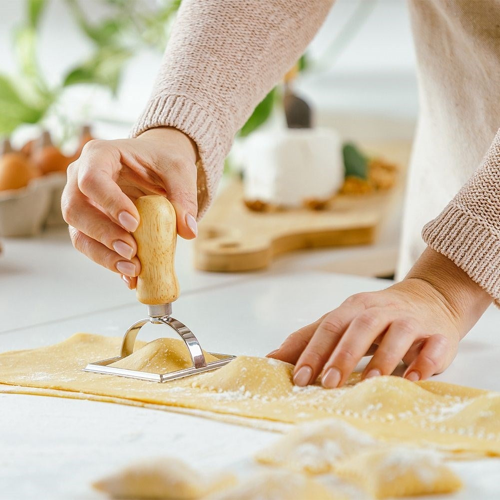 Ravioli cutter in metal and wood for uniform shapes