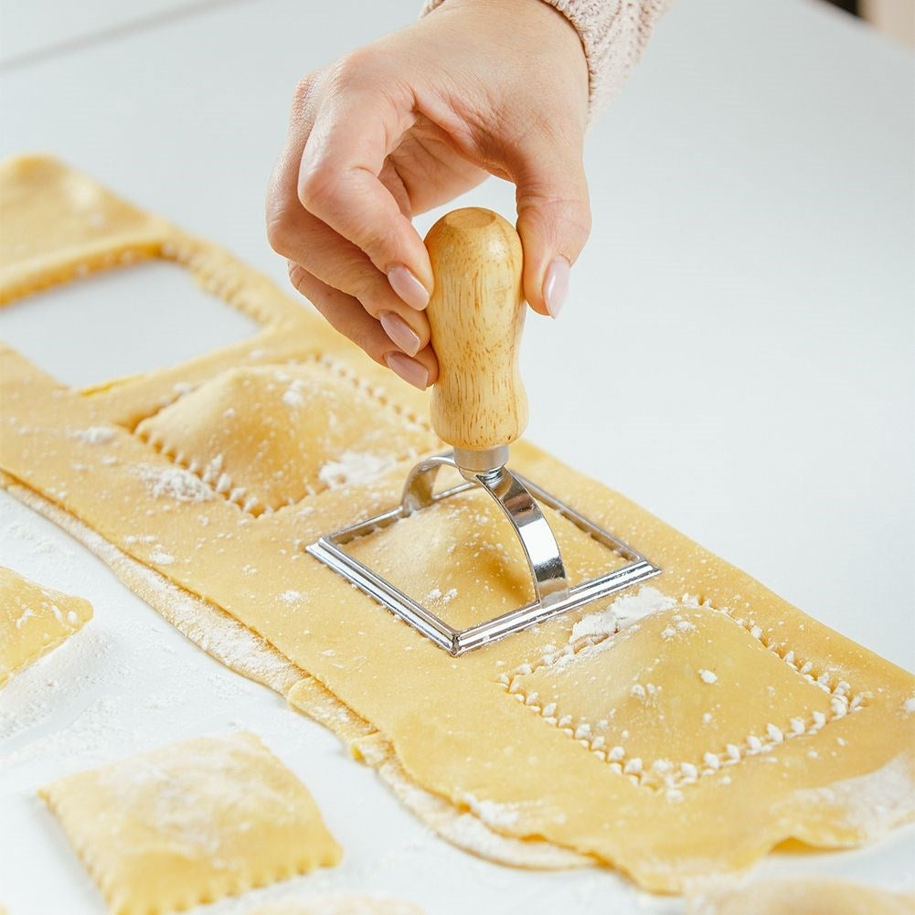 Ravioli cutter in metal and wood for uniform shapes