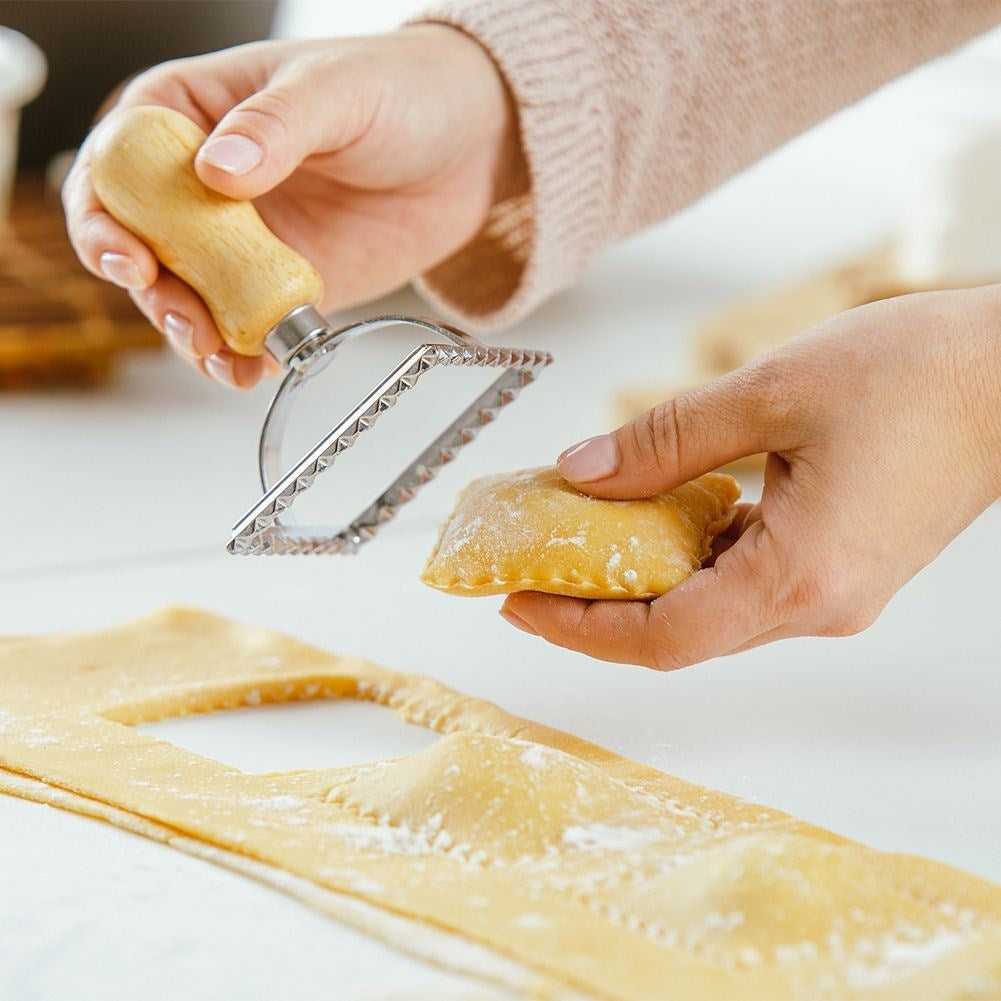 Ravioli cutter in metal and wood for uniform shapes