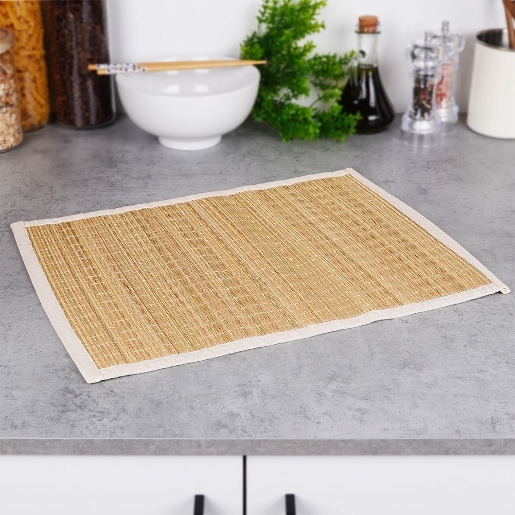 Rectangular rattan kitchen mat covered in beige cotton