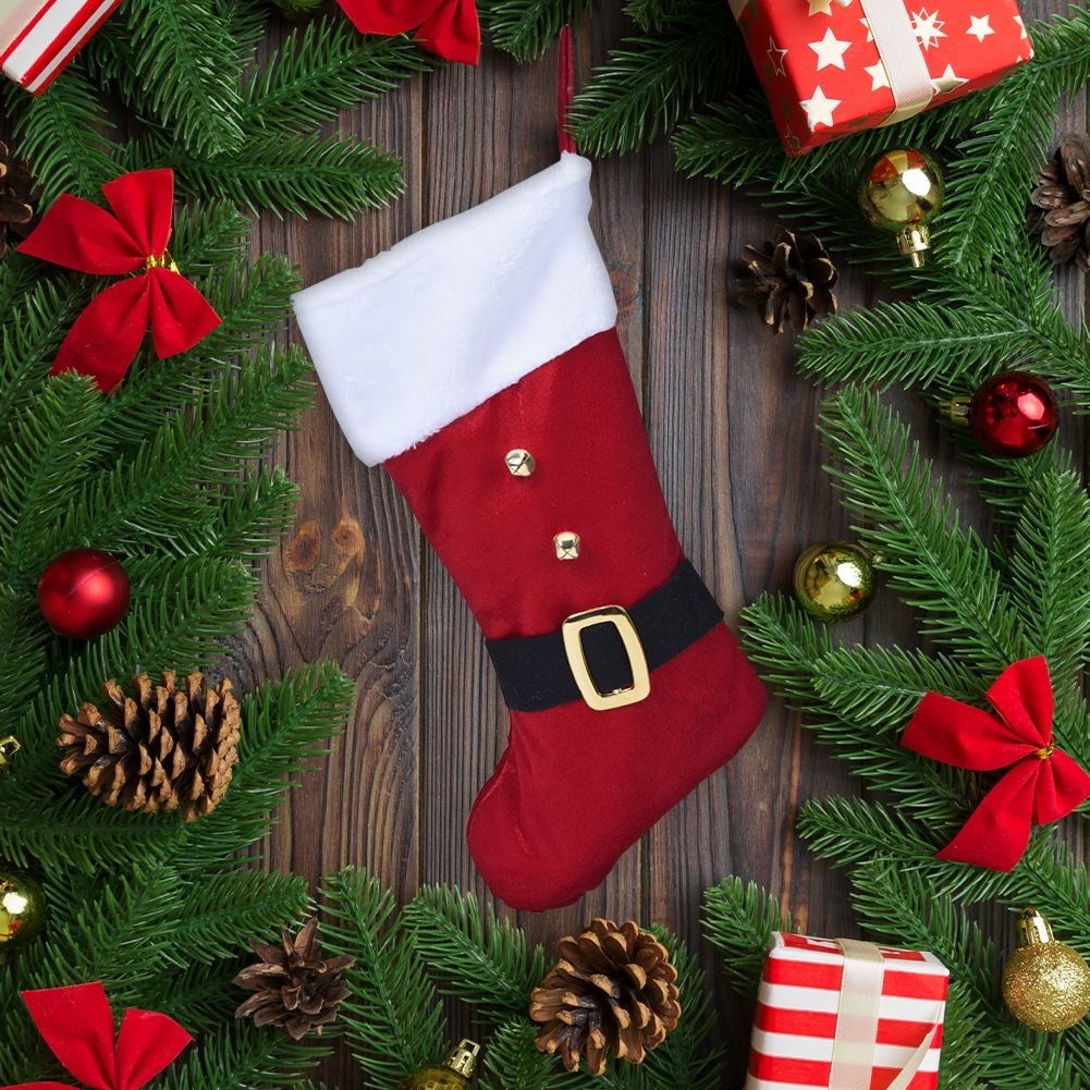 Red Christmas stocking in soft material for Christmas gifts and presents