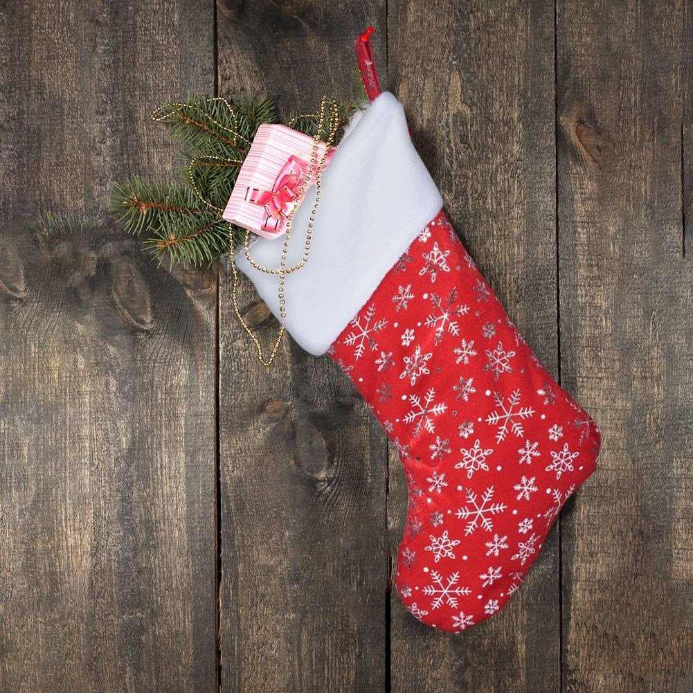 Red Christmas stocking with silvery snowflakes, soft material