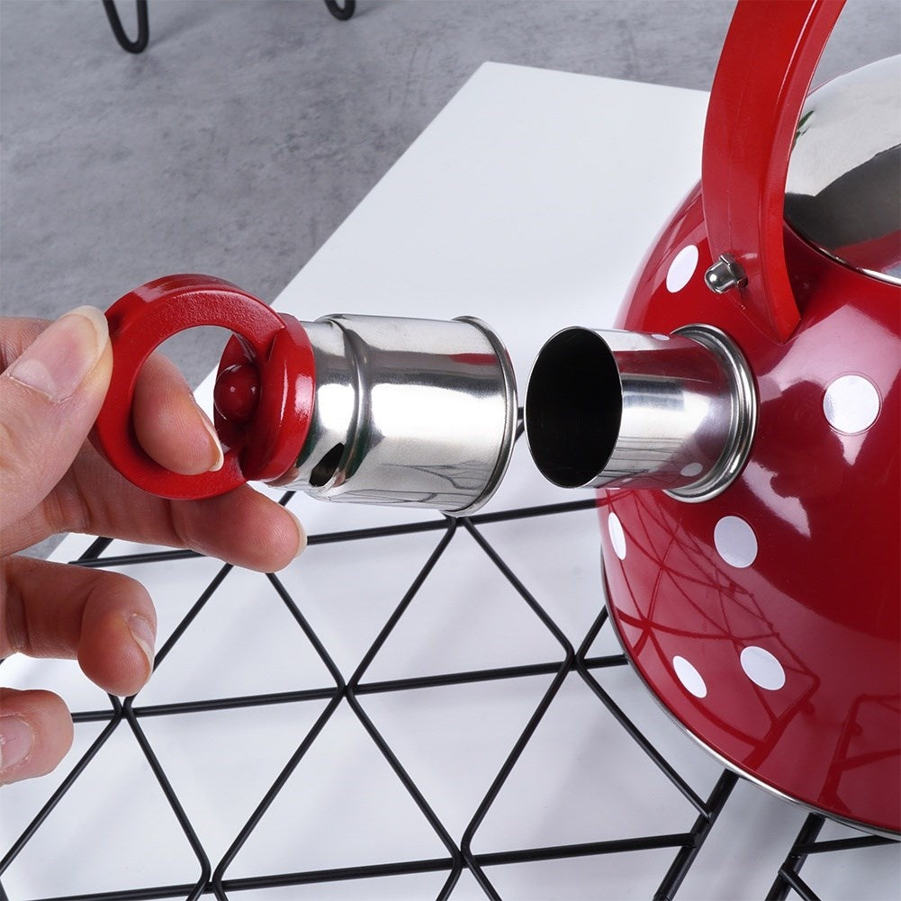 Red teapot in stainless steel with dots and whistle