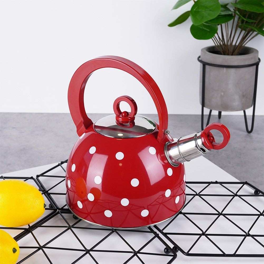 Red teapot in stainless steel with dots and whistle