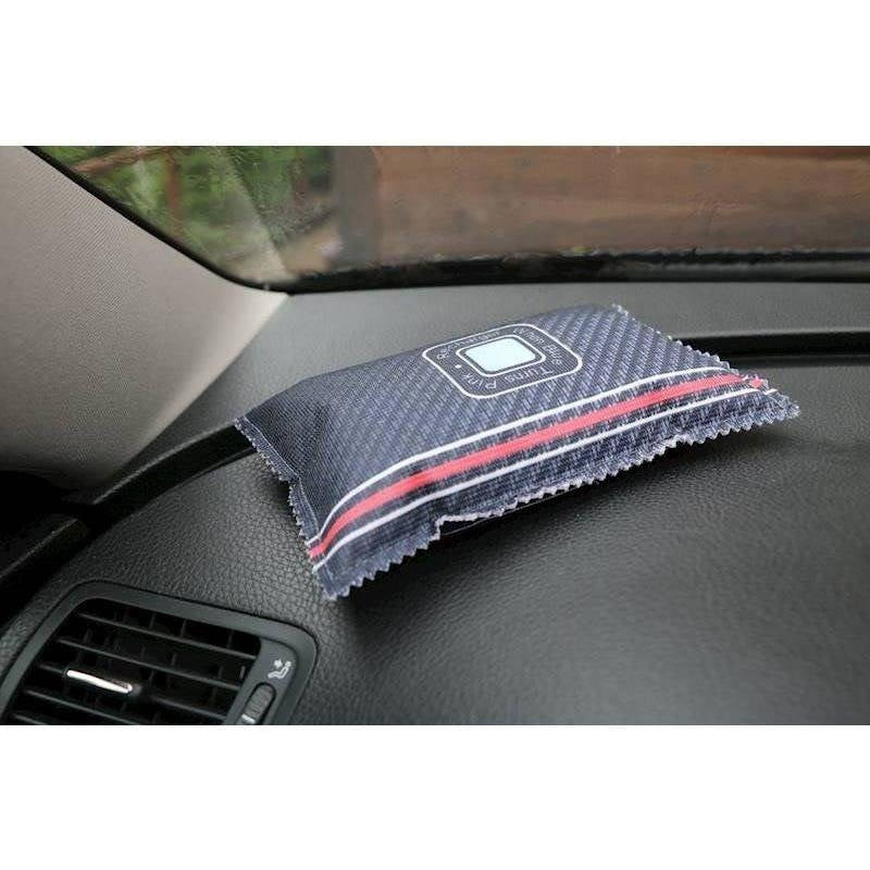 Reusable moisture absorbent pad for the car