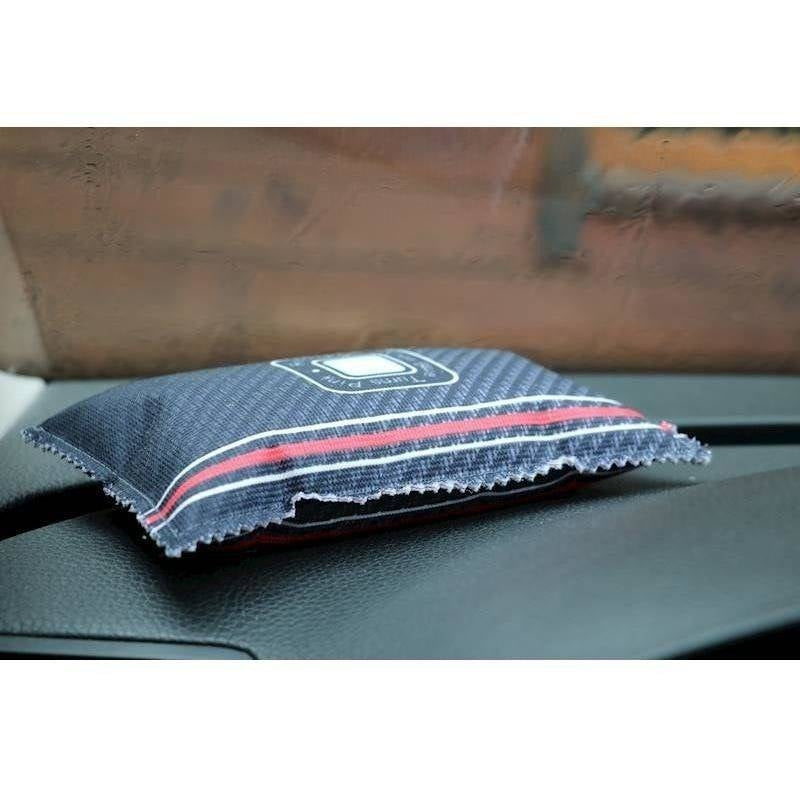 Reusable moisture absorbent pad for the car