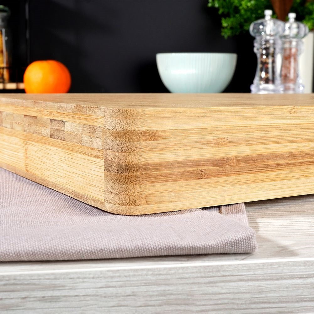 Robust bamboo cutting board for cutting and serving food