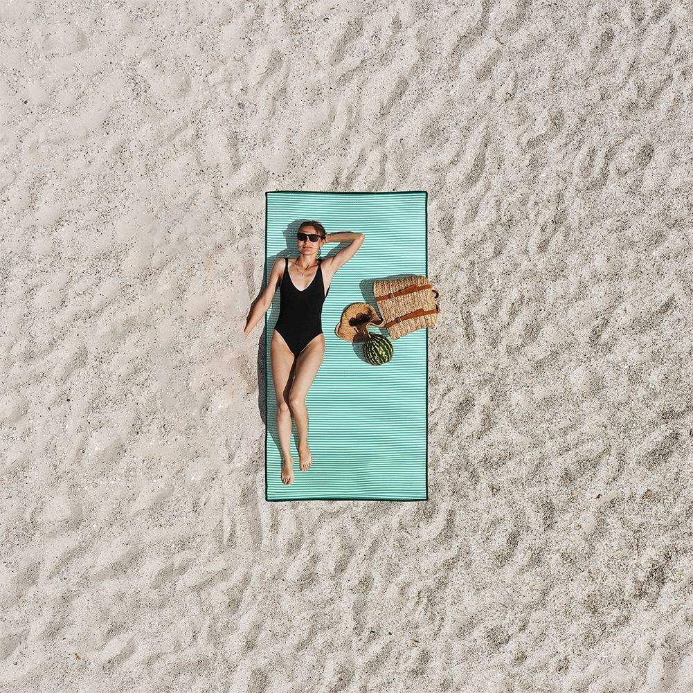 Rollable beach mat with comfortable handle and light weight