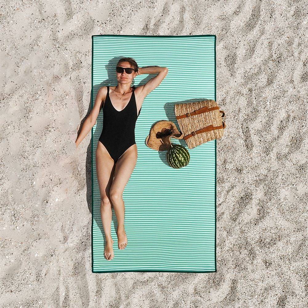 Rollable beach mat with comfortable handle and light weight