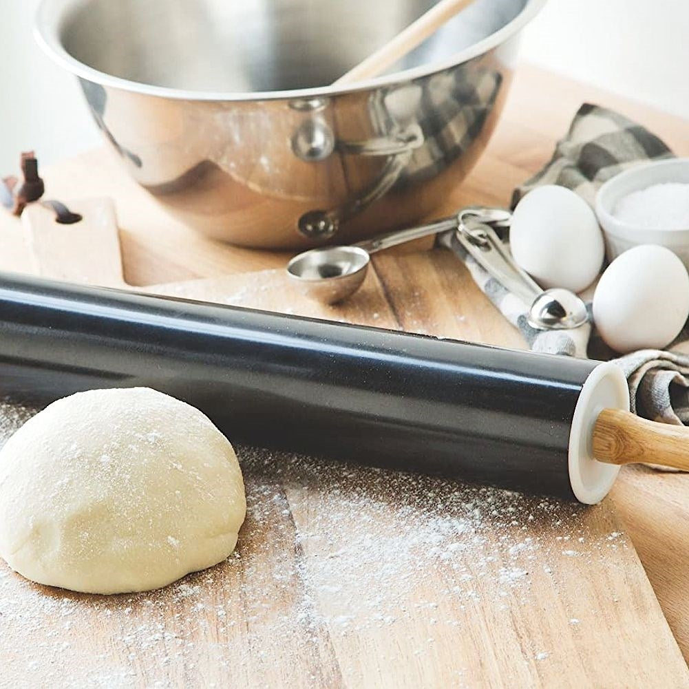 Rotating rolling pin with non-stick metal and wooden handle
