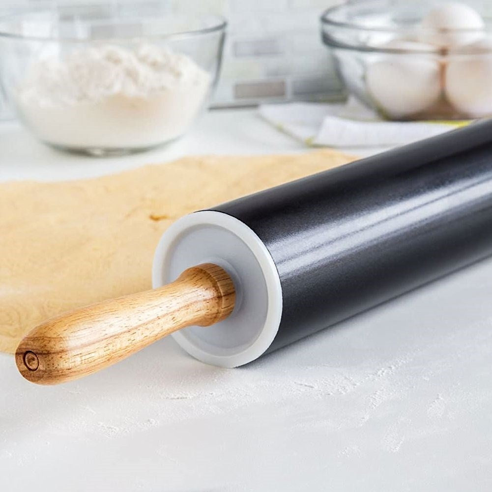 Rotating rolling pin with non-stick metal and wooden handle