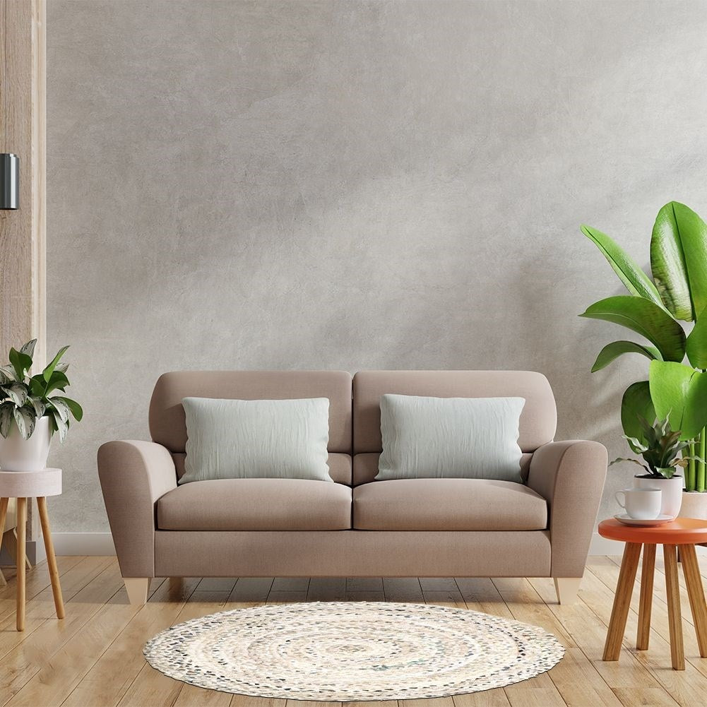 Round beige cotton rug with an interesting pattern