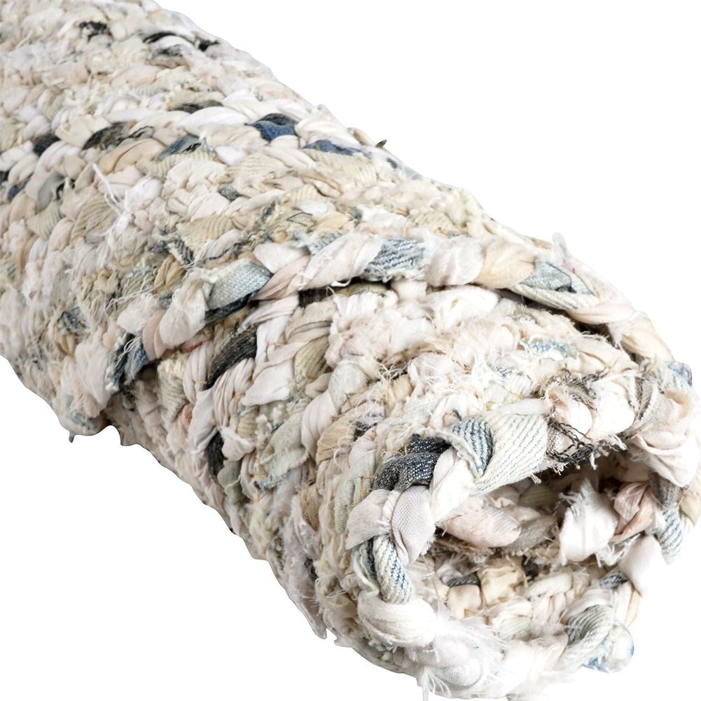 Round beige cotton rug with an interesting pattern