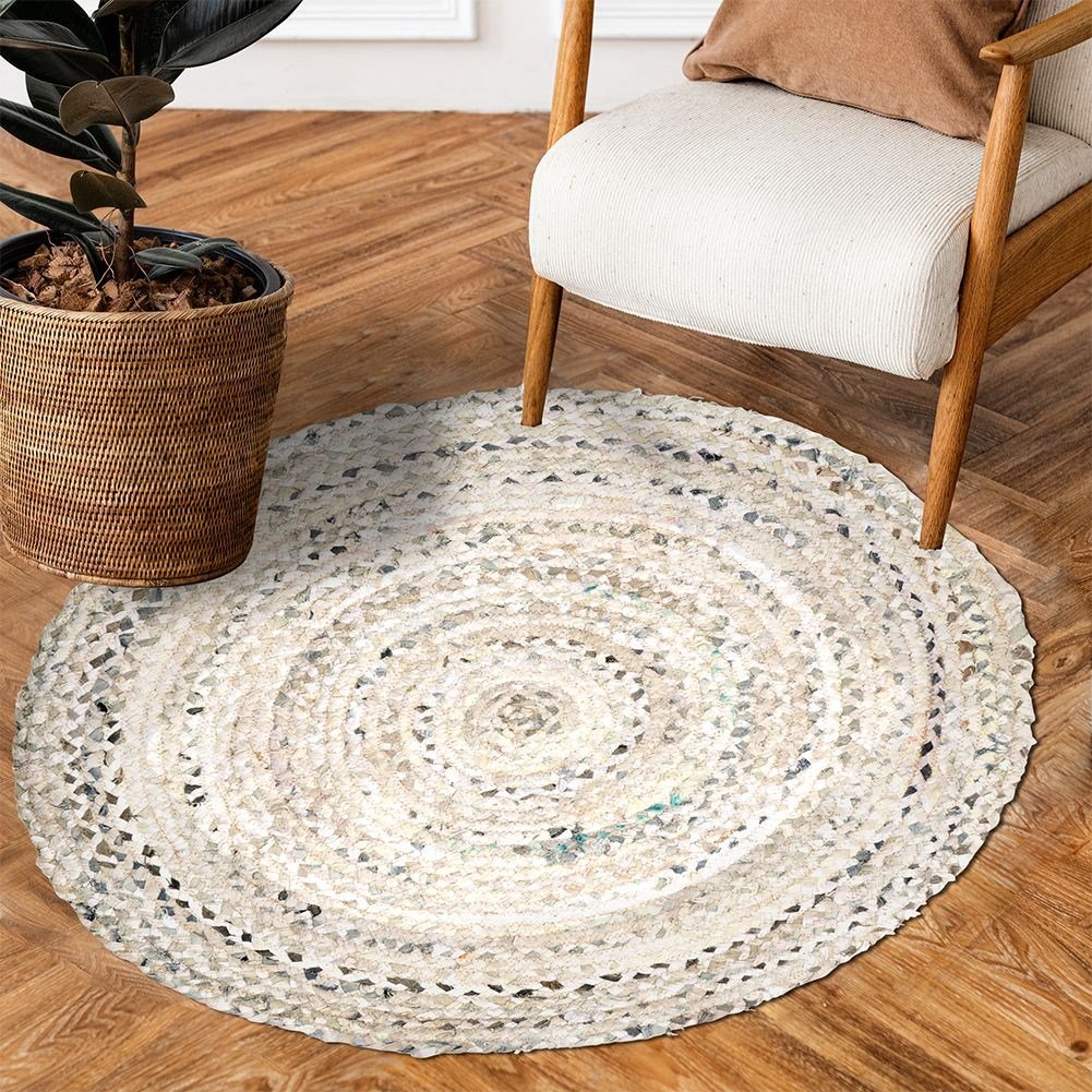 Round beige cotton rug with an interesting pattern