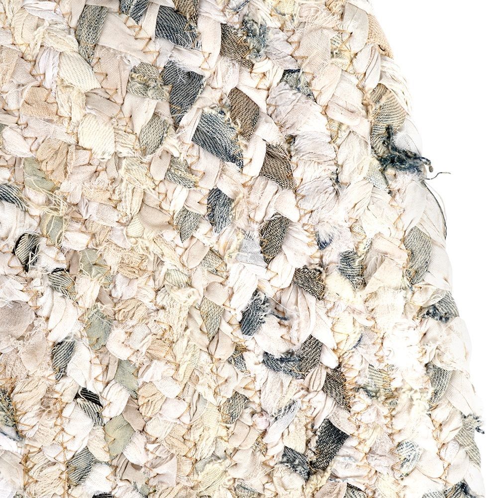 Round beige cotton rug with an interesting pattern