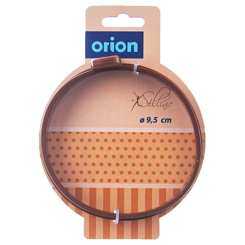 Round brown silicone mold for eggs and pancakes with handle