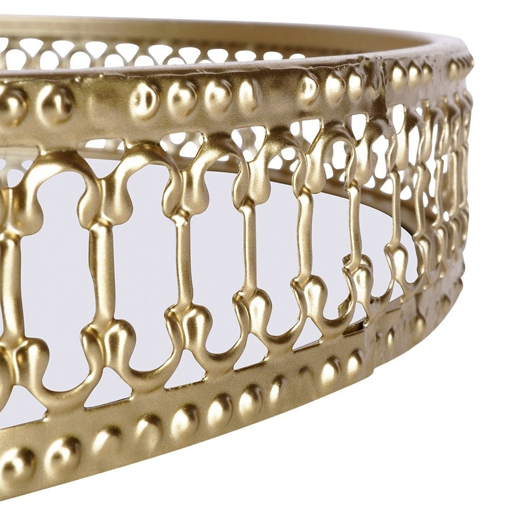 Round mirror tray in gold and glass for candles.