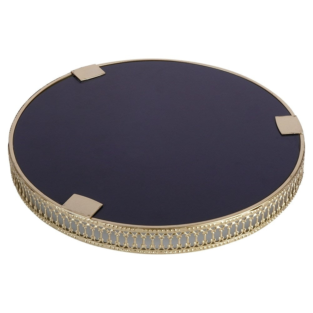 Round mirror tray in gold and glass for candles.