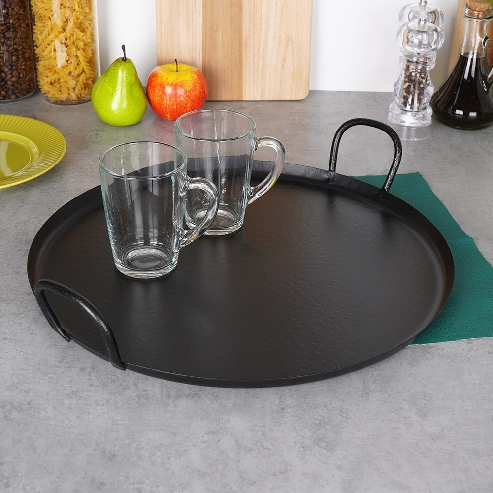 Round serving tray in matt black stainless steel