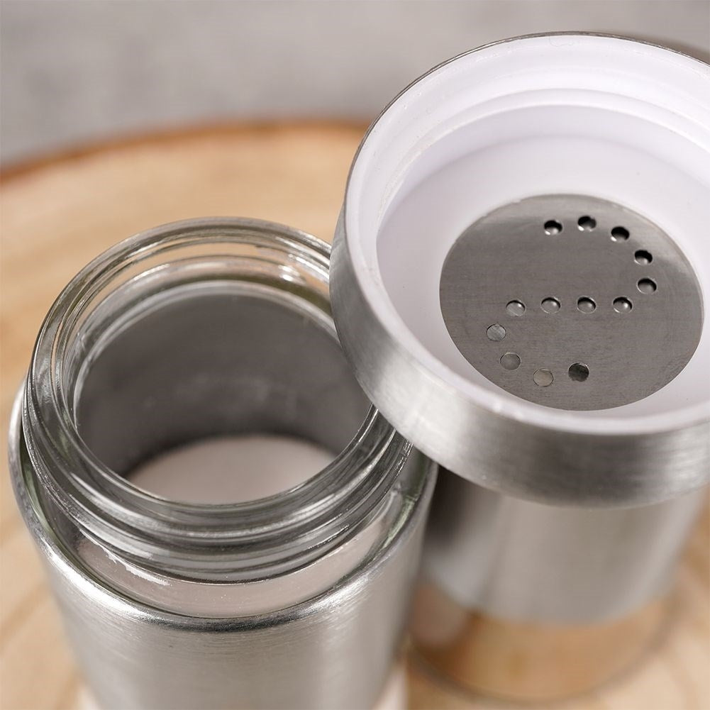 Salt and pepper shaker set in glass and stainless steel