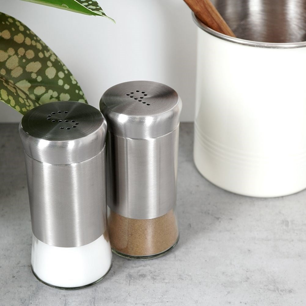 Salt and pepper shaker set in glass and stainless steel