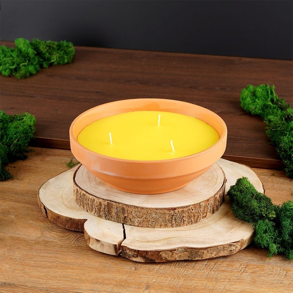 Scented candles with lemon oil for a refreshing and cozy atmosphere
