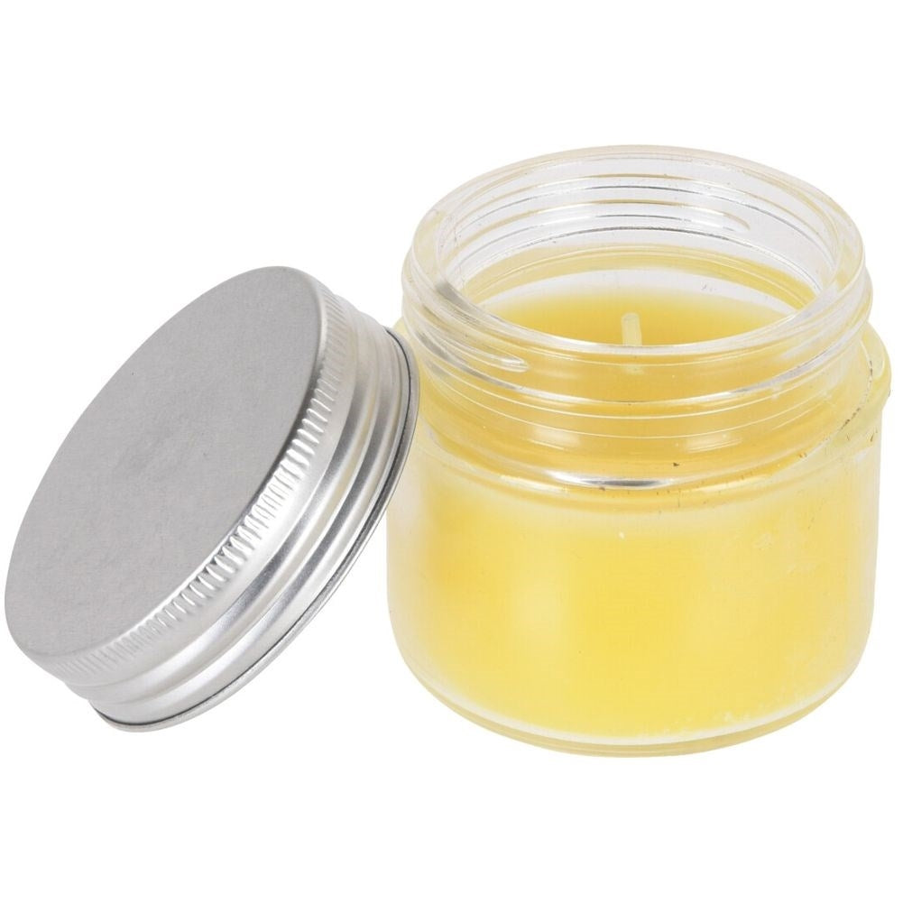 Scented candle with essential lemon oil for a cozy atmosphere