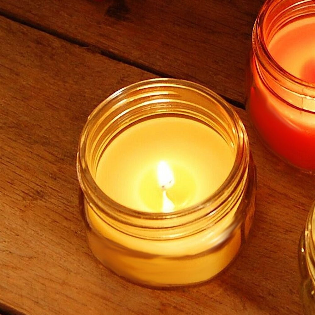 Scented candle with essential lemon oil for a cozy atmosphere